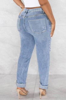 Light modern plus size jeans with a slight rip and diagonal zip