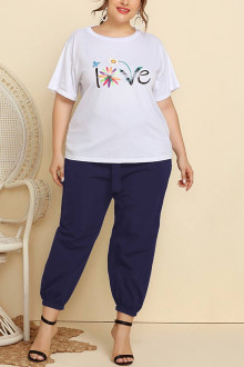 Plus size set of pants and white blouse with a print