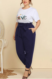 Plus size set of pants and white blouse with a print