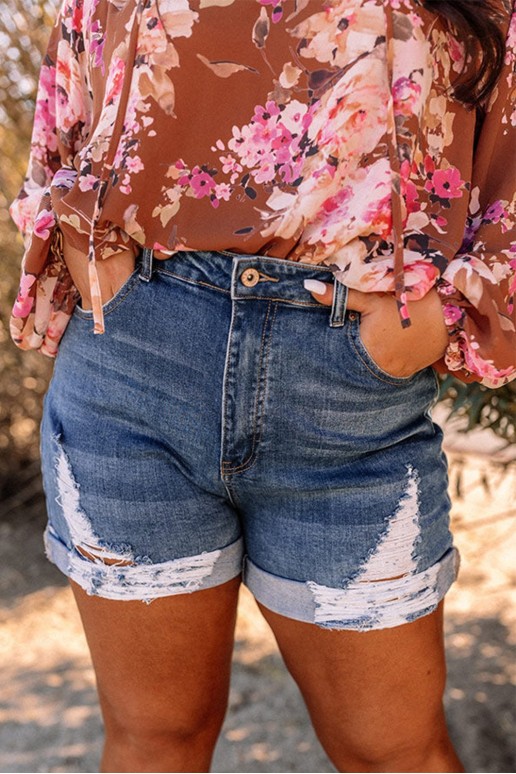 Maxi denim shorts with torn and disheveled legs