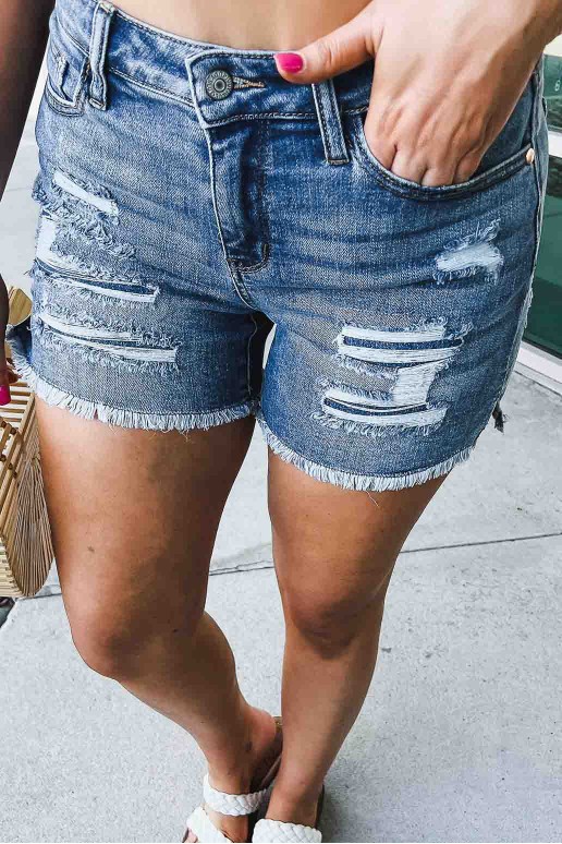 Plus size denim shorts with torn and internal patches
