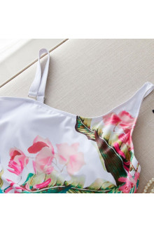 Stylish white plus size swimsuit with a floral print