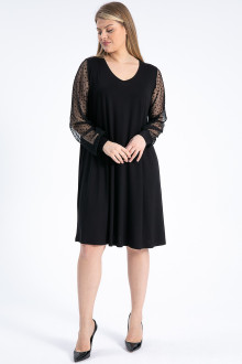 Luxurious black plus size dress with ethereal polka dot sleeves