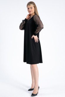 Luxurious black plus size dress with ethereal polka dot sleeves