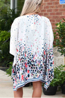 An ethereal maxi kimono with a print of colored dots