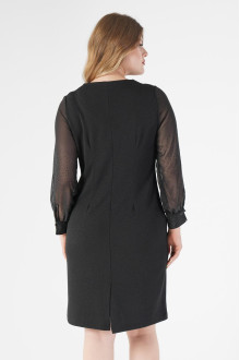 Luxurious black plus size dress with slightly sheer shimmery sleeves