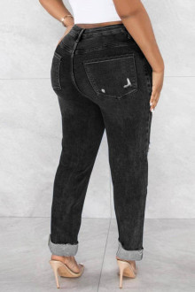 Modern black Plus size jeans with a slight rip and diagonal zip