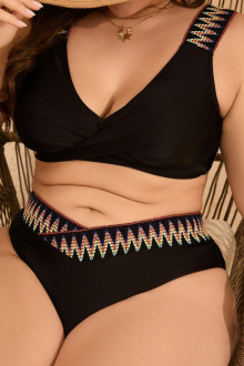 Black swimsuit with twisted neckline and ethnic motifs