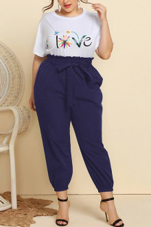 Plus size set of pants and white blouse with a print