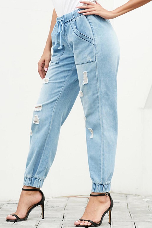 Light ripped jeans with elastic on the belt and legs