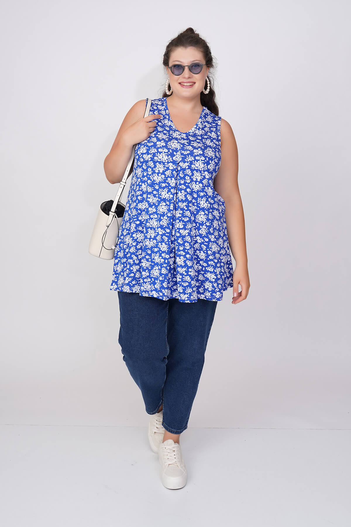 White sleeveless blouse with openwork fine braid